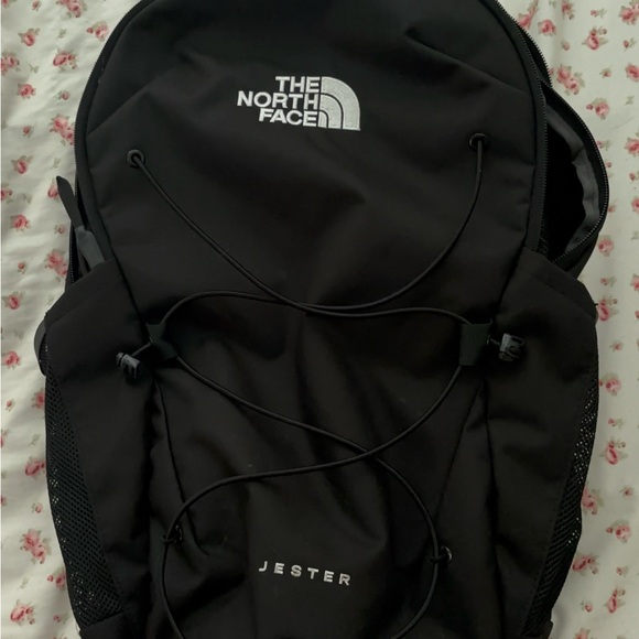 The North Face Black Backpack with Modern Design and Bungee Storage (Brand New)